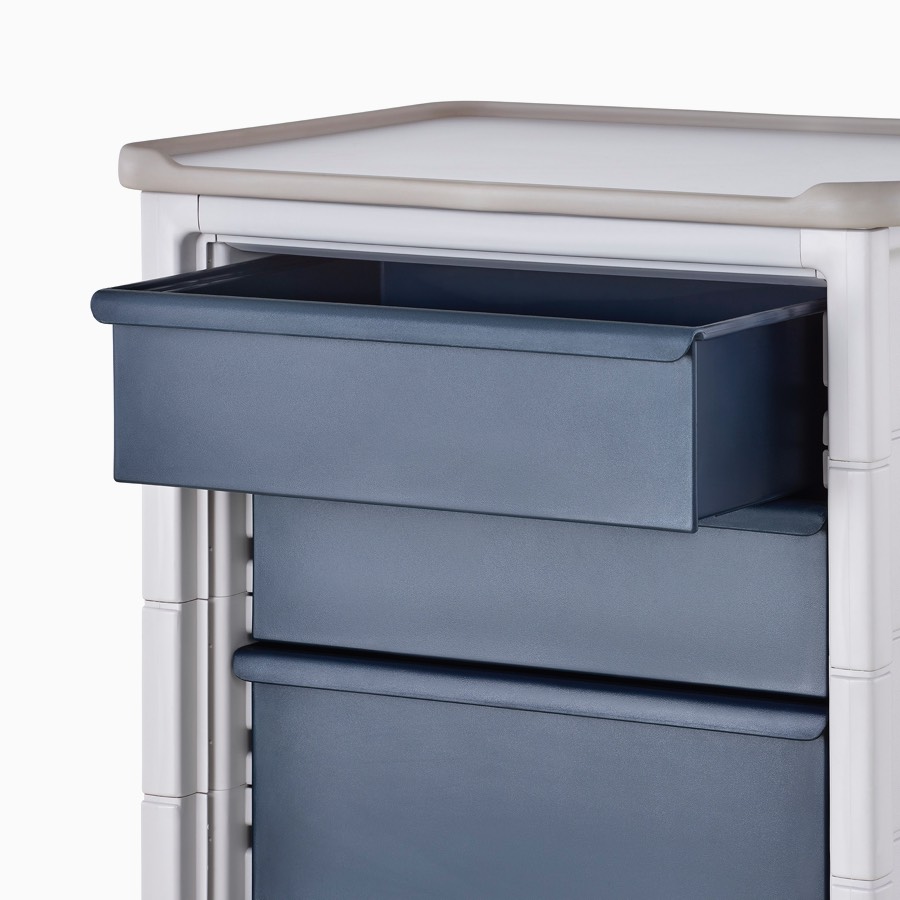 Detail of Procedure and Supply Cart in a light gray body and dark blue six-inch modular drawer.