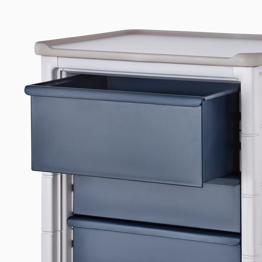 Detail of Procedure and Supply Cart in a light gray body and dark blue nine-inch modular drawer.