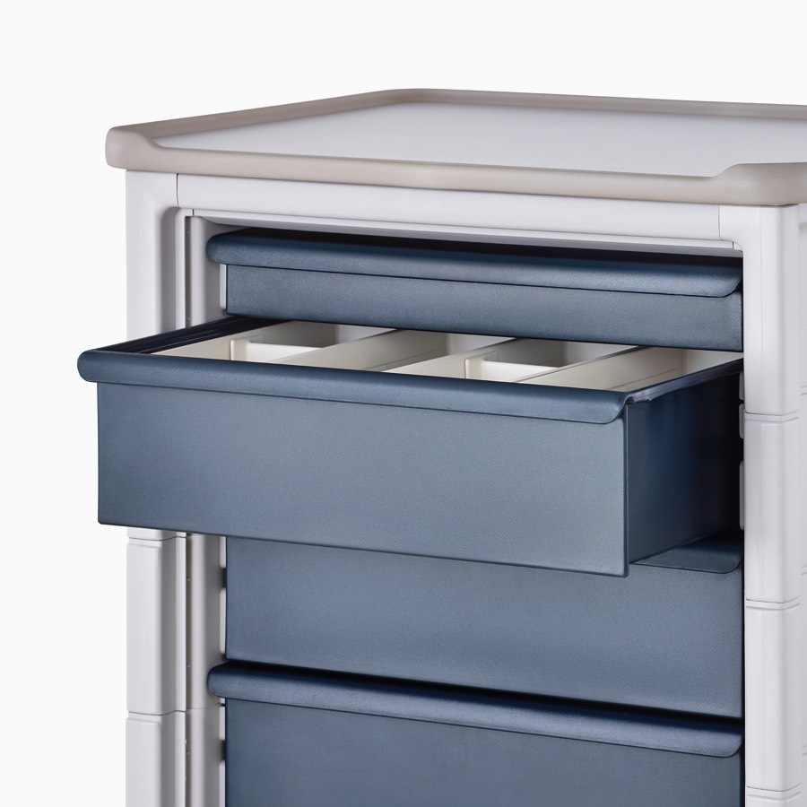 Detail of Procedure and Supply Cart in a light gray body and dark blue modular drawers with interior subcontainer drawer organizers.