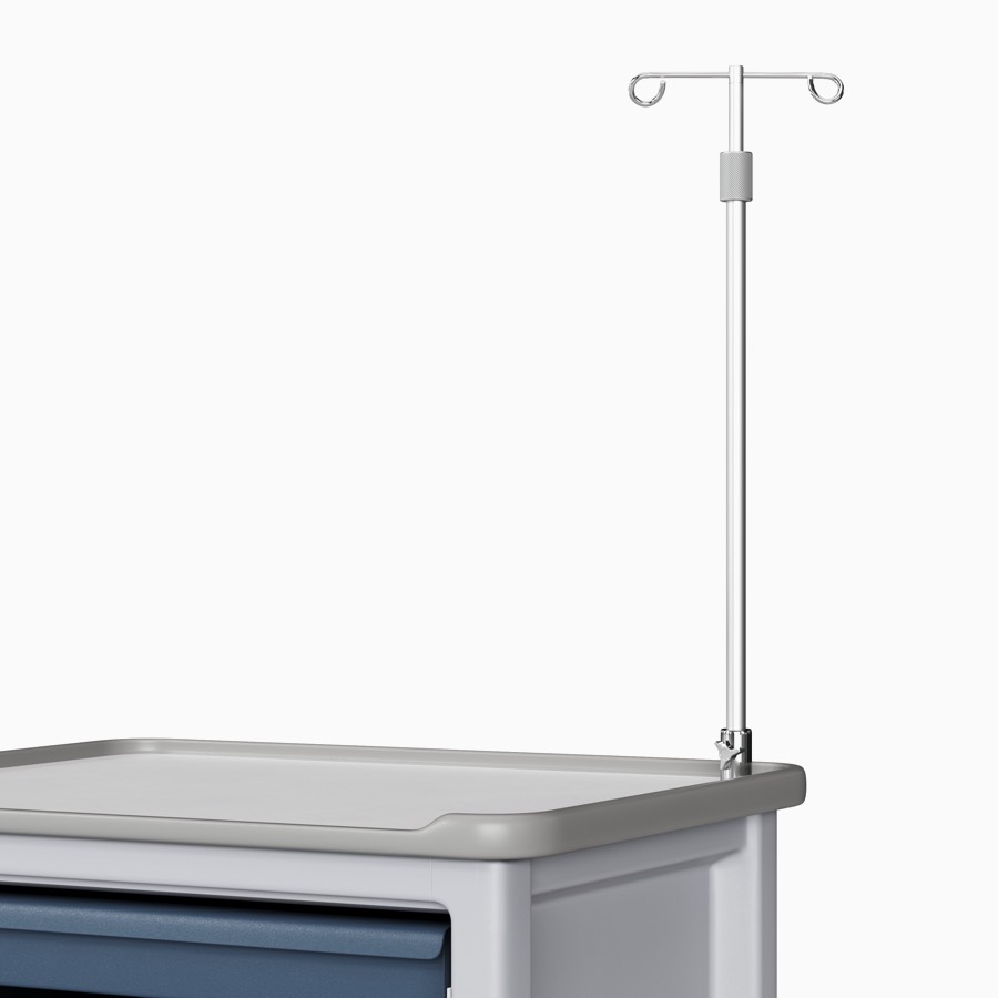 A procedure and supply cart in a light gray body and midnight blue drawers with an IV pole mounted to the top of the cart.