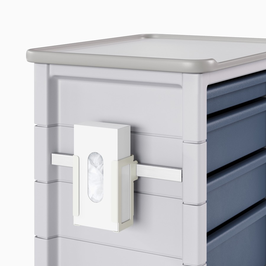 Supply cart with a gray body and midnight blue drawers with an adapter rail attached to the side that's holding a glove box holder with a glove box.