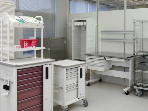 A healthcare utility room containing multiple Procedure/Supply Carts with interchangeable drawers and accessories. A healthcare utility room containing multiple Procedure/Supply Carts with interchangeable drawers and accessories.