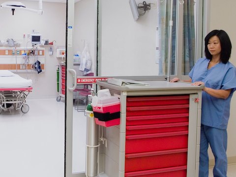 A nurse pushes a mobile Procedure/Supply Cart with seven interchangeable drawers. A nurse pushes a mobile Procedure/Supply Cart with seven interchangeable drawers.