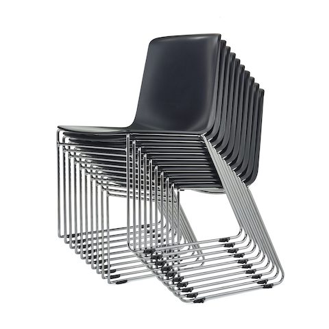 A stack of black Pronta chairs with chrome legs.