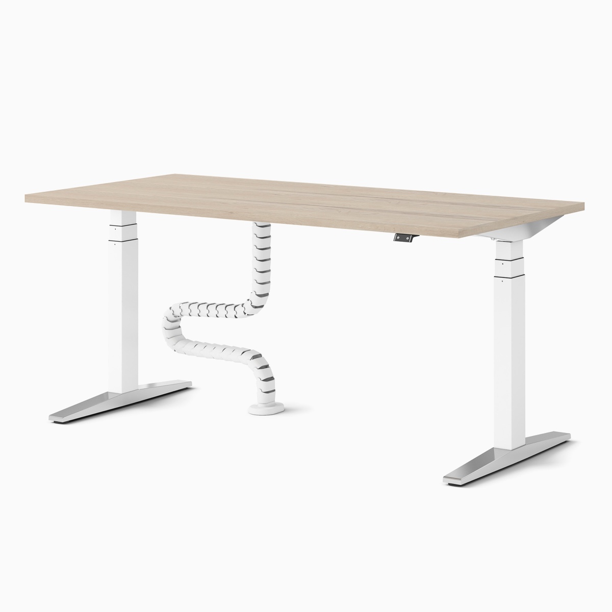 A single Ratio height-adjustable desk with a wooden worktop and floor-to-work-surface cable umbilical.