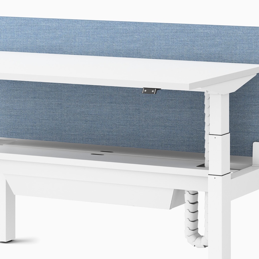Close-up view of a Ratio height-adjustable desk with a high-capacity tray.