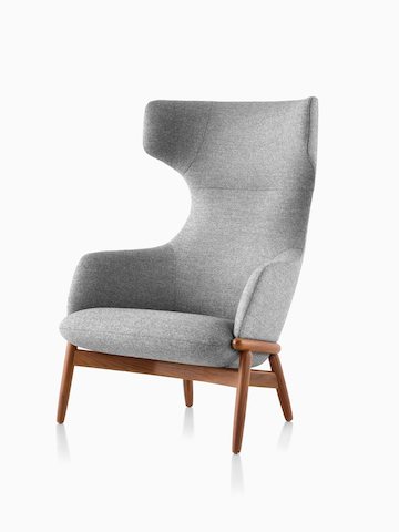A wing-back Reframe Lounge Chair in Panno Di Dolce Flannel, viewed from an angle.