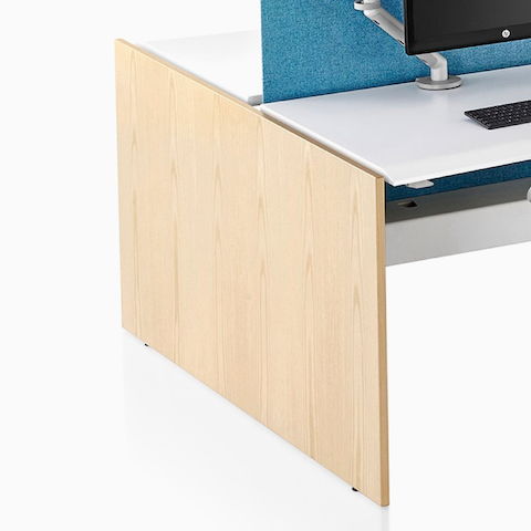 A close-up view of a Renew Link standing desk system's light wood gallery panel screen.
