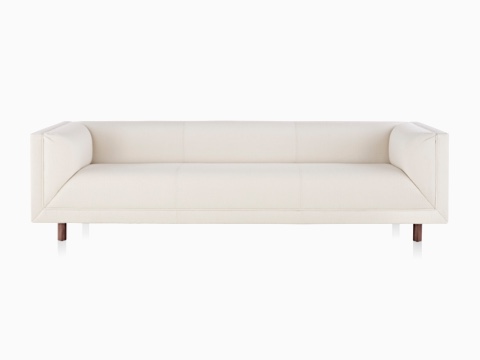 White Rolled Arm Sofa with wood legs, viewed from the front. White Rolled Arm Sofa with wood legs, viewed from the front.