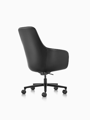 Three-quarter rear view of a black leather Saiba executive chair with a black five-star base and casters.