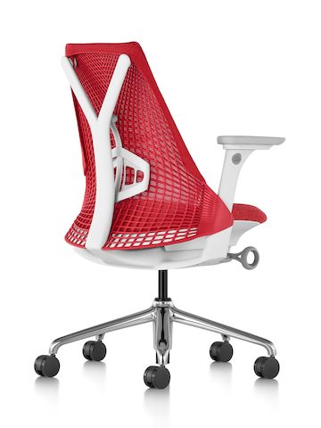 Rear view of a red Sayl office chair, showing the resemblance of the suspension back to a sail.
