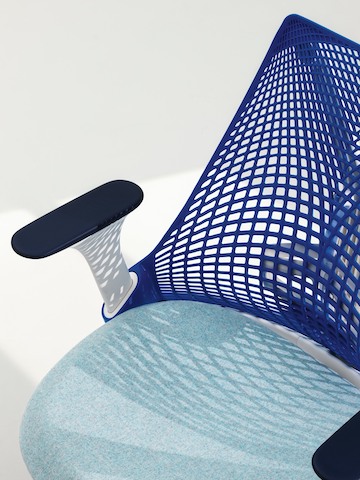 Sayl office chair with purple suspension back and light blue upholstered seat, viewed from above. Sayl office chair with purple suspension back and light blue upholstered seat, viewed from above.