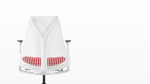 White Sayl office chair with suspension back and red upholstered seat, viewed from behind. White Sayl office chair with suspension back and red upholstered seat, viewed from behind.