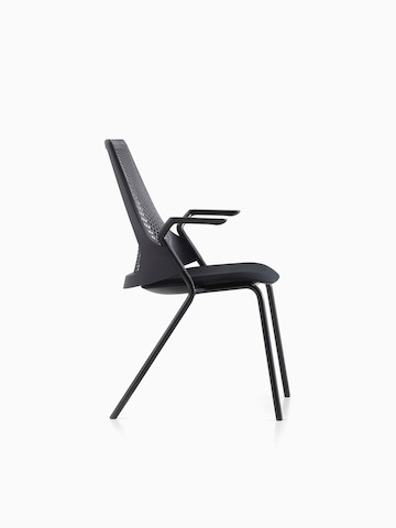 Profile view of the four-leg version of a black Sayl Side Chair.
