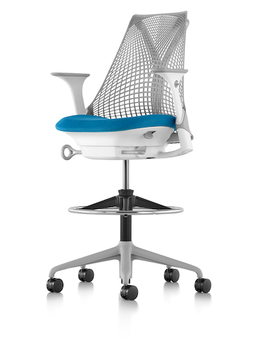 Light gray Sayl Stool with a blue seat, viewed from a 45-degree angle. 