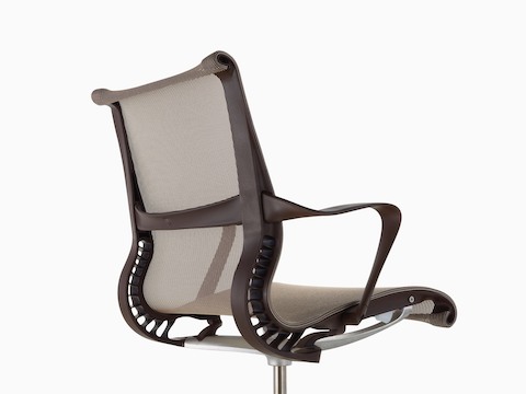 Three-quarter rear view of a light brown Setu office chair.