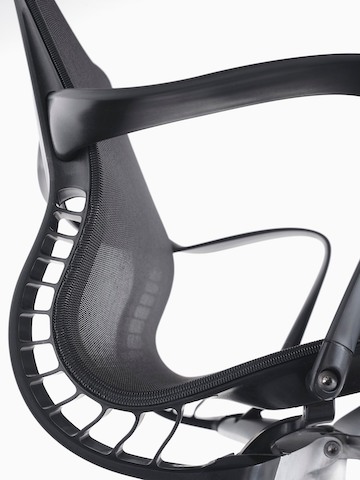 Close-up of the flexing back on a black Setu office chair.