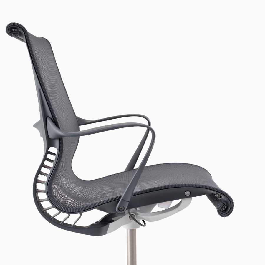 A close-up side view of a Setu chair with arms in gray.