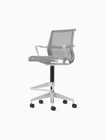 Front-angle view of a Setu Stool with fixed arms, a light grey frame, silver alloy base and light grey suspension.