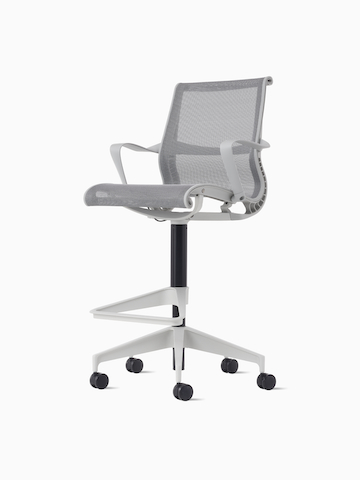 Front-angle view of a Setu Stool with fixed arms, a light grey frame, silver alloy base and light grey suspension.
