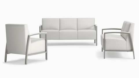A trio of Brava Modern Lounge Seating consisting of one chair, a two seat, and three seat, all with solid surface arm caps.