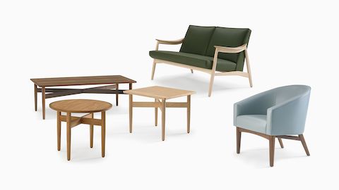 An arrangement of Nemschoff Hemlock end tables and coffee table, Sophora Lounge Chair, and Aspen Settee.