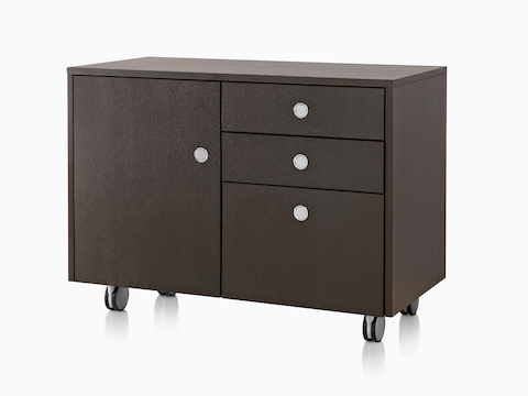 Angled view of a mobile Sled Base Storage double unit consisting of two box drawers, a file drawer, and a cabinet. 