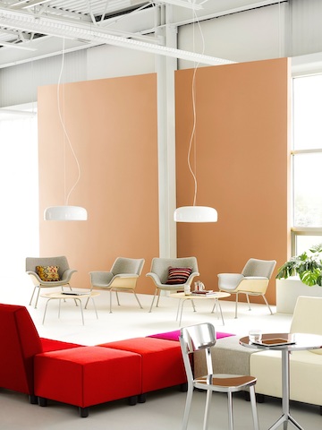 Casual seating area featuring multicolored Swoop modular seating and gray Swoop lounge chairs. Casual seating area featuring multicolored Swoop modular seating and gray Swoop lounge chairs.