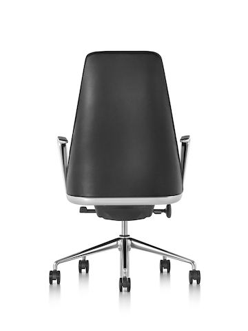 Profile view of a black leather Taper executive chair.