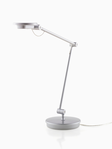 A silver Tone Personal Light with an articulating arm.