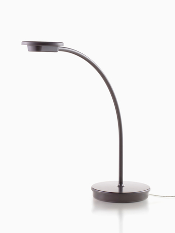 A black Tone Personal Light with a single curved arm.