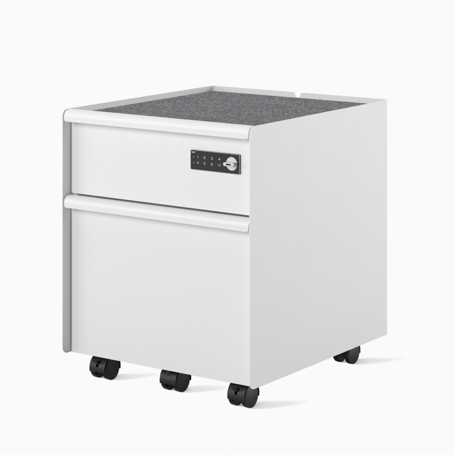 Front-angle view of a white Trac pedestal with a drawer/file configuration, PET liner, casters, digital lock, and metal drawer pulls.