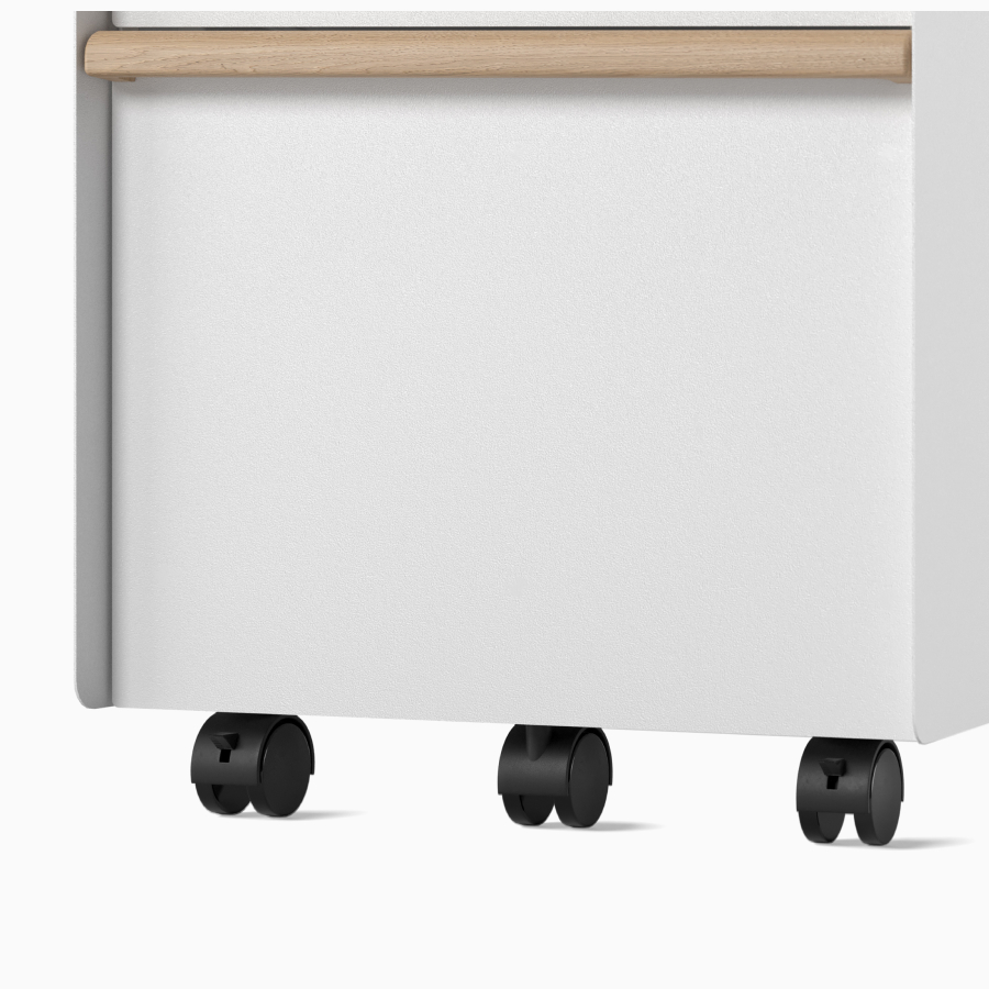 Close-up view of casters on a Trac pedestal.