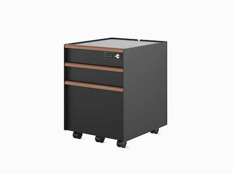 A black Trac pedestal with a drawer/drawer/file configuration, PET liner, casters, digital lock, and wooden drawer pulls.