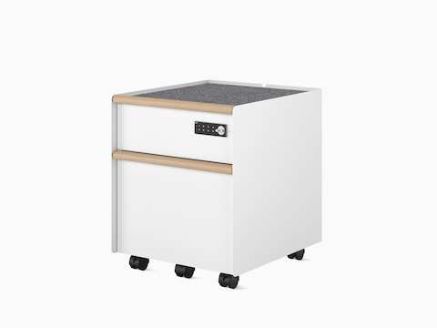  A Trac pedestal with a drawer/file configuration in white with PET liner, casters, digital lock, and wooden drawer pulls.