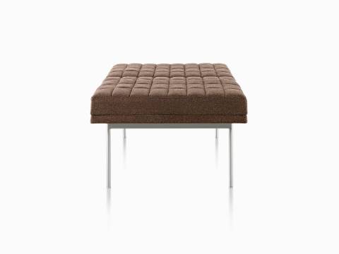Brown Tuxedo Bench with quilted upholstery and satin chrome base, viewed from the side.