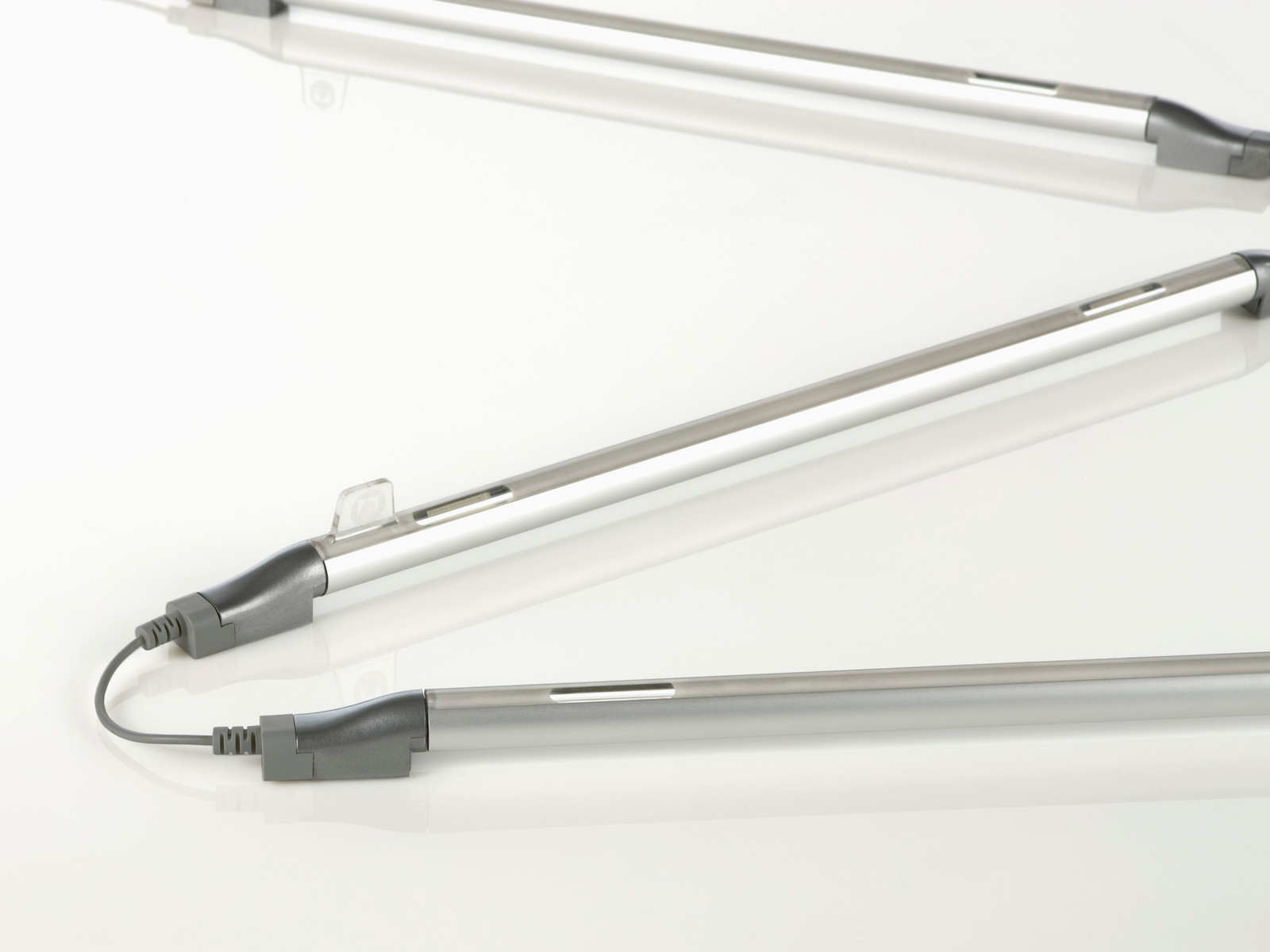 Three Twist LED Task Lights daisy-chained together. Three Twist LED Task Lights daisy-chained together.