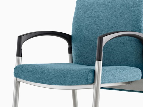 Angled view of a blue Valor Multiple Seating chair with a memory foam seat, steel frame, and black arms.