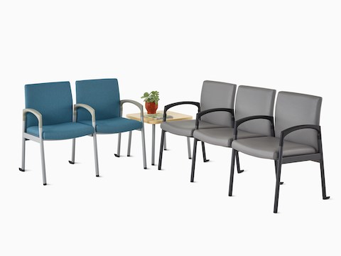 Valor two-seat multiple seating in blue with a silver frame, along with a Valor three-seat multiple seating in dark gray with black frame, and a Valor side table in ash wood laminate top and silver frame.