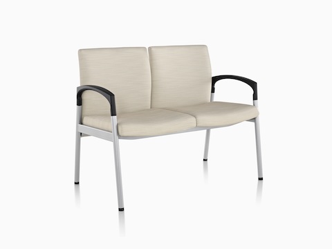 Angled view of beige Valor Multiple Seating with two seats, a steel frame and black arms.