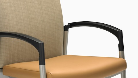 A Valor Stack Chair with an orange seat and beige back, viewed from a 45-degree angle.