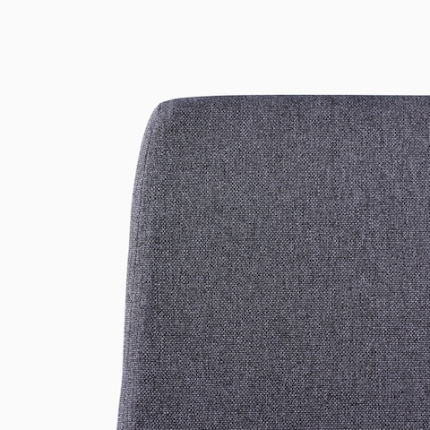 A close-up view of a Verus Chair's black upholstered back.