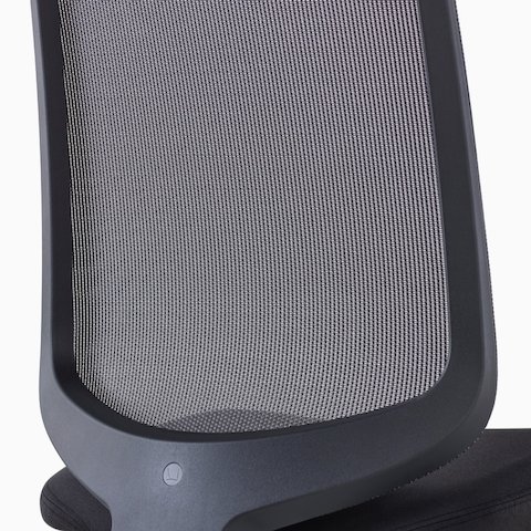 A close-up view of a Verus Chair's black suspension back with no additional support.
