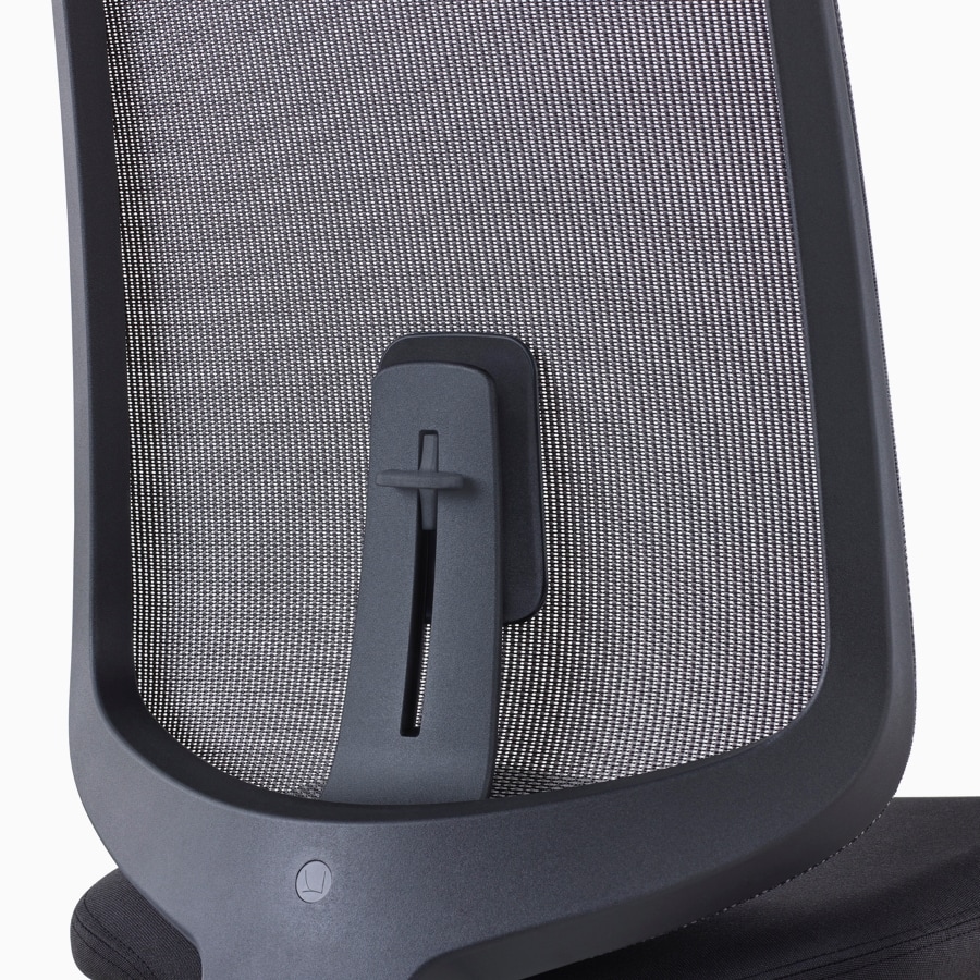 A close-up view of a Verus Chair's black suspension back with adjustable lumbar support.