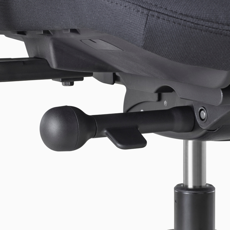 A close-up view of a Verus Chair's black adjustment knob.