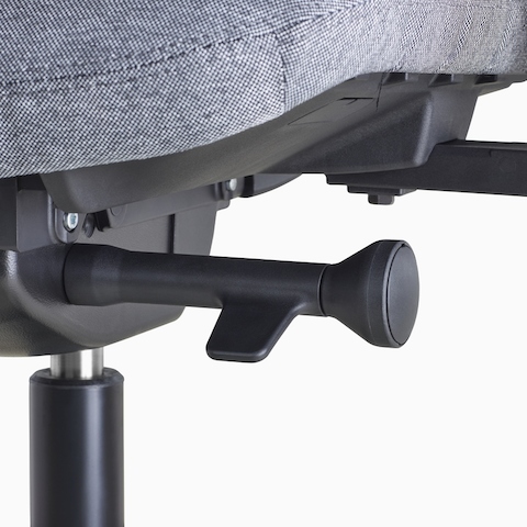 A close-up view of a Verus Chair's black adjustment knob.