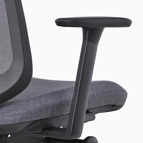 A close-up view of a Verus Chair's black fixed arm.