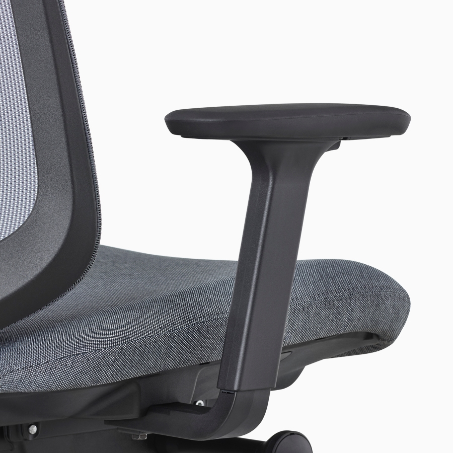 A close-up view of a Verus Chair's black adjustable-height arm.