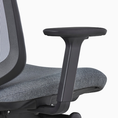 A close-up view of a Verus Chair's black adjustable-height arm.