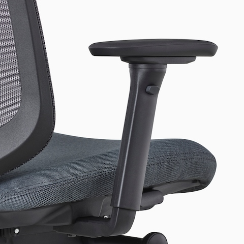 A close-up view of a Verus Chair's black fully-adjustable arm.